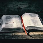 white book page on black wooden table