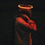 person wearing long-sleeved top with halo