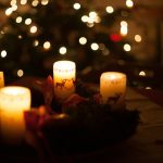 white candles on brown wooden table