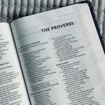 white book page on black and white textile