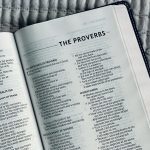 white book page on black and white textile