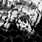 man holding DSLR camera