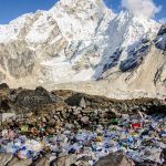 rocky mountain covered with snow during daytime