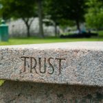 gray concrete cross on gray concrete surface