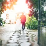 bride and groom walking on pathway