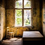 closed brown wood-framed glass window