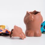 a couple of pieces of chocolate sitting next to each other