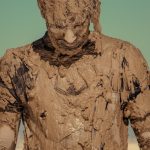 man in brown and black crew neck shirt