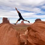 man jumping on canyon