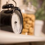 black and silver alarm clock