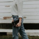 woman standing holding black boko