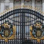black metal gate with blue and white lion and lion print