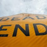 a close up of a dead end sign