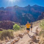 two person running through the field