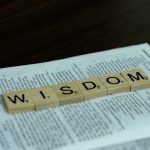 a word made out of scrabbled wood blocks sitting on top of a